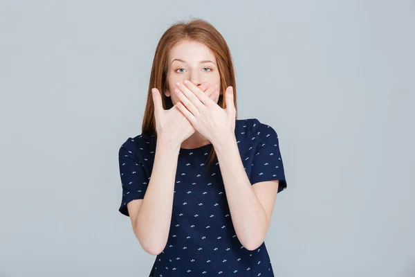 Woman covering her mouth with palms — Stock Photo, Image