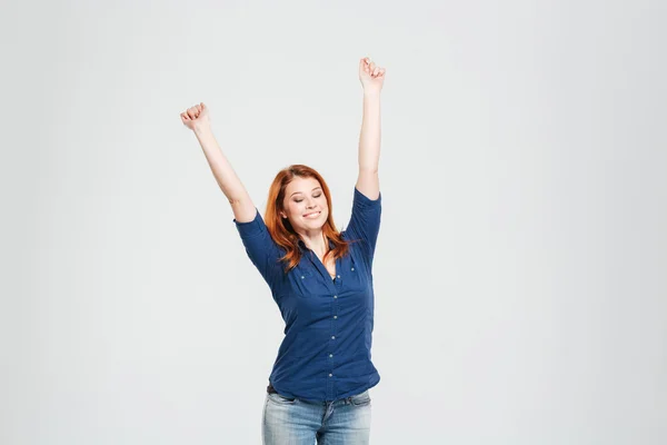 Happy relaxed woman stretching with eyes closed and raised hands — Stock Photo, Image