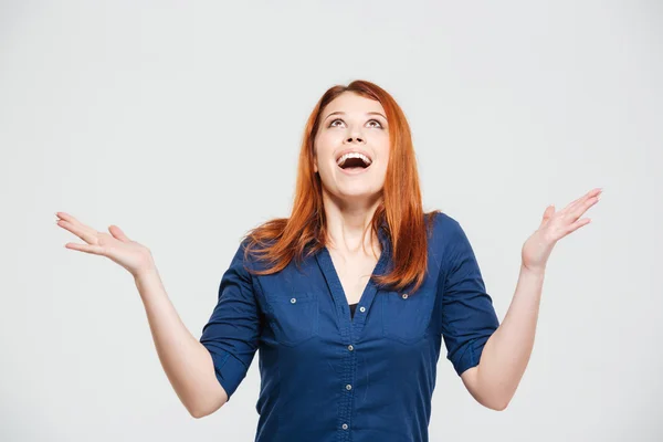 Excited happy woman trying to catch something falling from sky — Stock Photo, Image