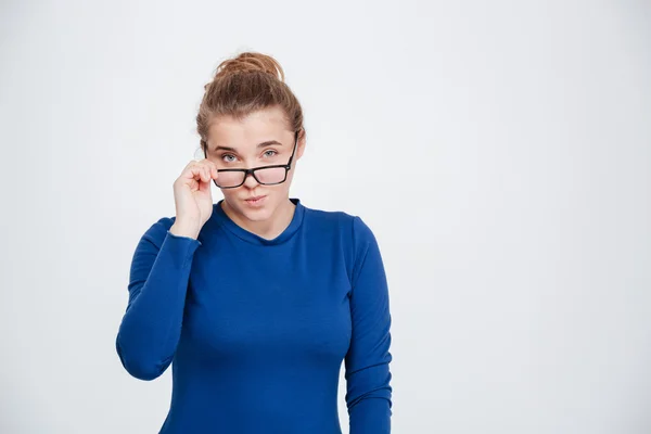 Serious woman in glasses looking at camera — Stock Photo, Image