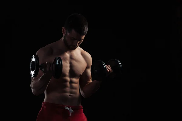 Handsome man workout with dumbbells — Stock Photo, Image