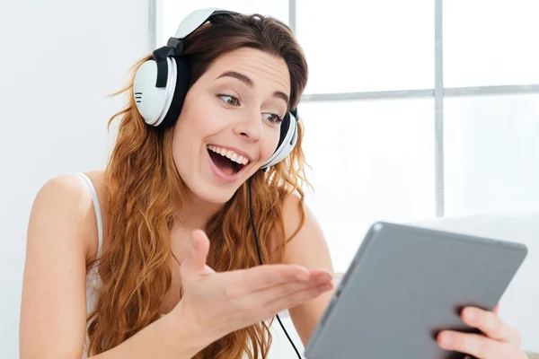 Cheerful woman video chatting on tablet computer — Stock Photo, Image