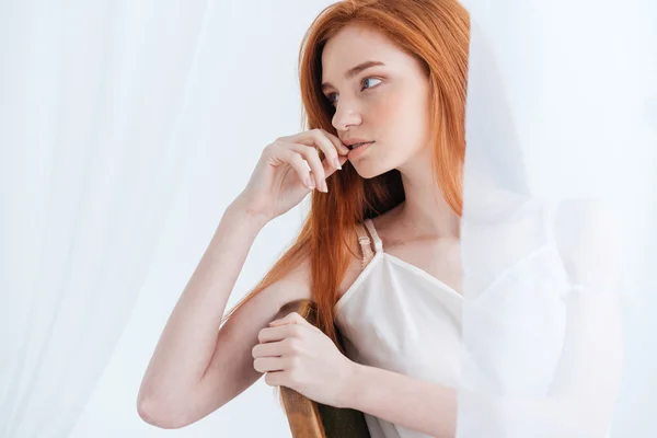 Thoughtful redhead woman looking away — Stock Photo, Image