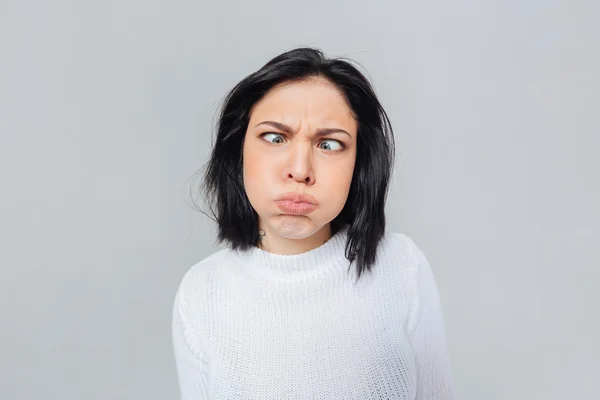 Mujer haciendo cara divertida —  Fotos de Stock