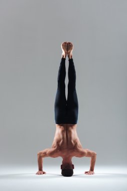 Man doing headstand clipart