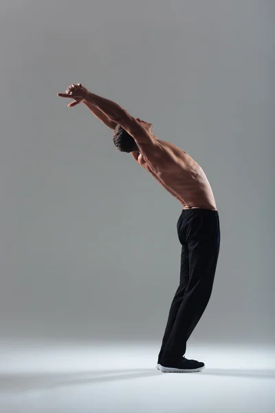 Sports man doing stretching exercises — Stock Photo, Image