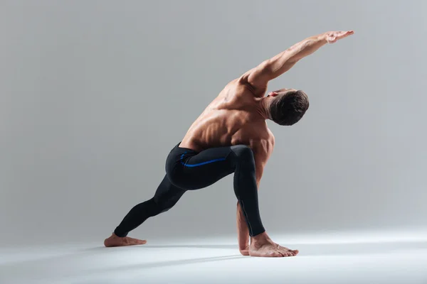 Handsome man doing yoga exercise — Stock Photo, Image