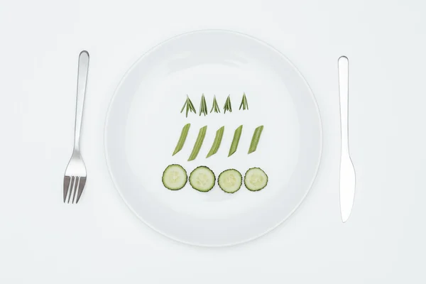 Top view of cucumber, rosemary and asparagus on the plate — Stock Photo, Image