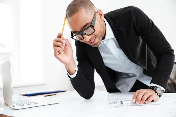 Close-up portrait of a businessman thinking at work — Stock Photo, Image