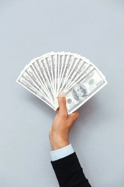 Closeup of human hand holding united states currency — Stock Photo, Image