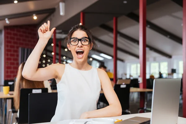 Cheerful excited businesswoman having an idea working in office — Stock Photo, Image