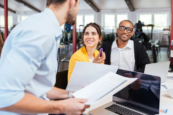 Happy young businesspeople working together in office — Stock Photo, Image