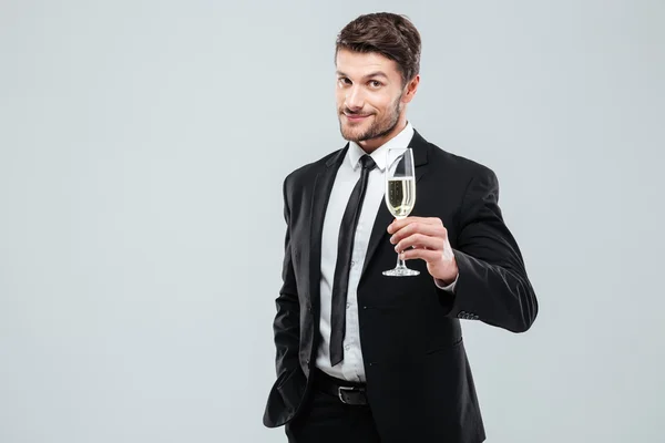 Üzletember öltöny és a nyakkendő pezsgő pohár pirítós — Stock Fotó