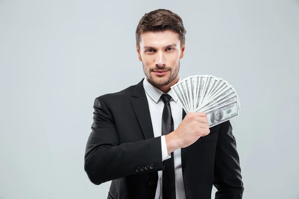 Retrato de belo jovem empresário segurando dinheiro — Fotografia de Stock