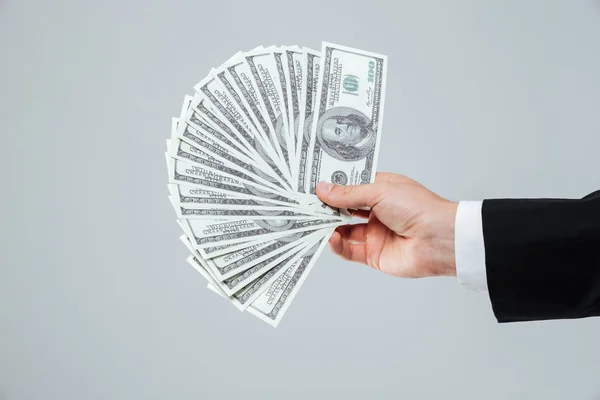 Hand van zakenman aanhouden van geld — Stockfoto