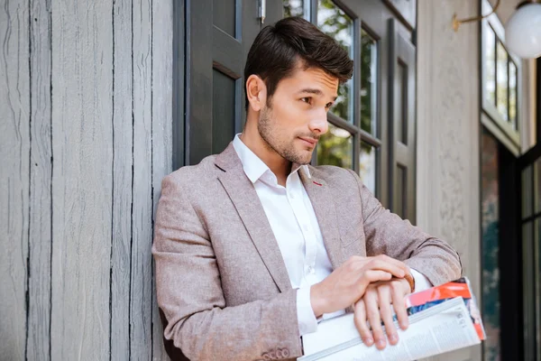 Close-up portrait of man looking at his watch outdoors — Stock Photo, Image