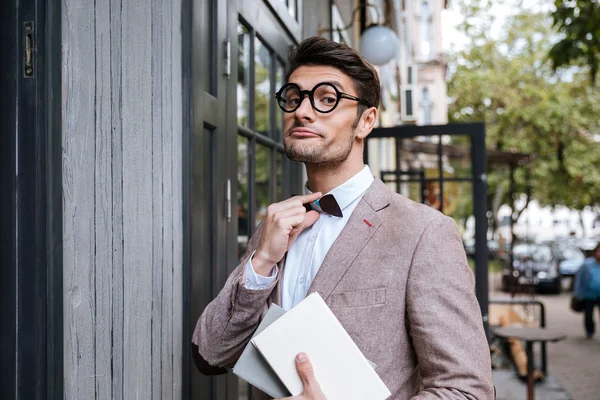 Funny man wearing eyeglasses and bow at the cafe — Stock Photo, Image