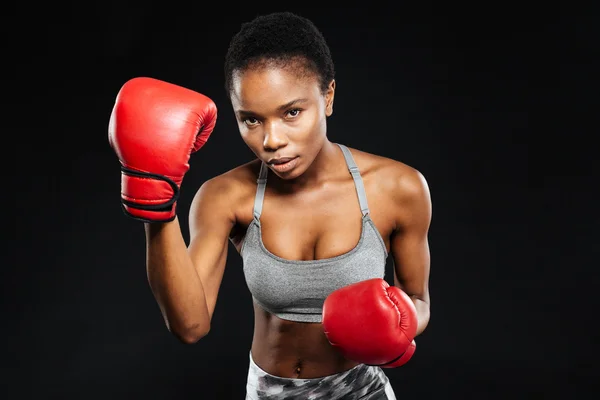 Fitness woman in booxing gloves on black background — Stock Photo, Image