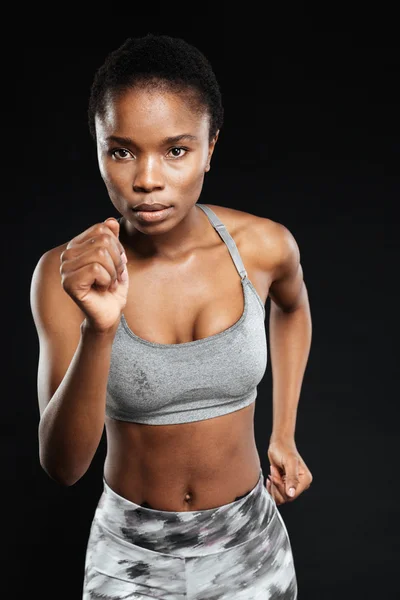 Close-up portrait of a sports african woman running — Stock Photo, Image