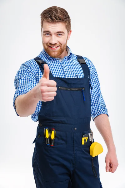 Glücklicher männlicher Bauunternehmer zeigt Daumen hoch — Stockfoto