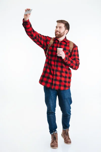 Man holding cup with coffee and making selfie photo — Stock Photo, Image