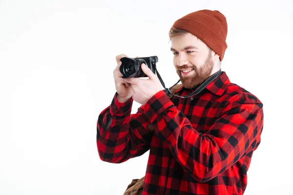 Jonge hipster man nemen foto met fotocamera — Stockfoto