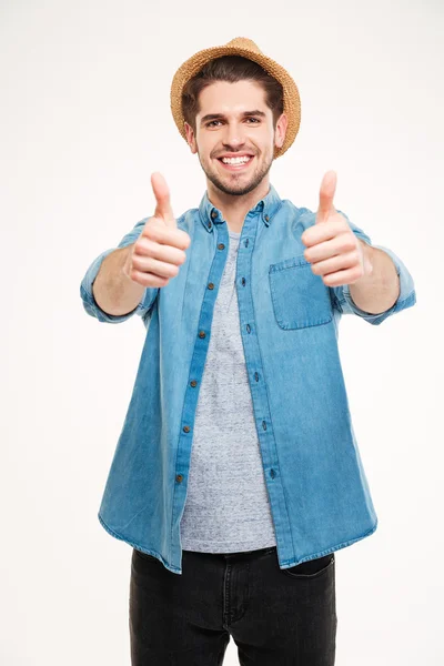 Joven alegre mostrando los pulgares hacia arriba — Foto de Stock