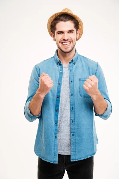 Casual handsome young man in hat rejoices isolated — Stock Photo, Image