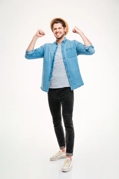 Cheerful young black man smiling and keeping arms raised — Stock Photo, Image