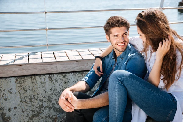 Portrait of a smiling young couple looking at each other — Stock Photo, Image
