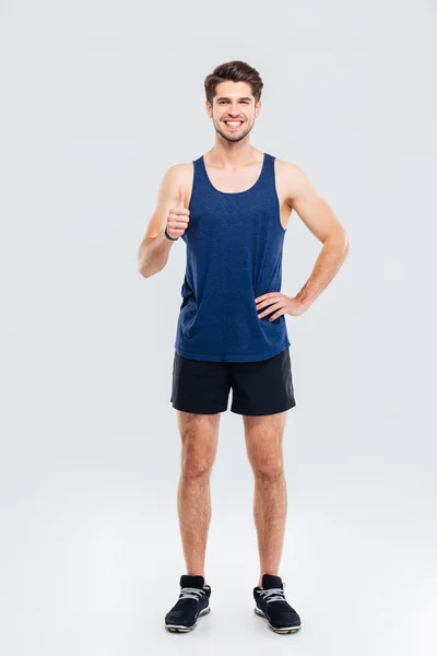 Full length portrait of a fitness man showing thumb up — Stock Photo, Image