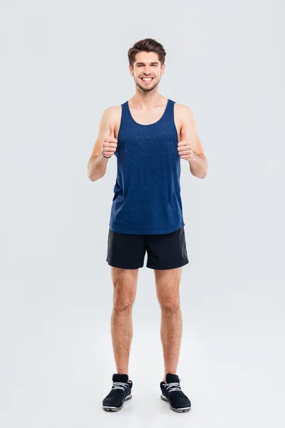 Full length portrait of a fitness man showing thumb up — Stock Photo, Image