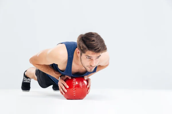 Sports man working out with fitness ball — Zdjęcie stockowe