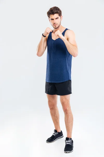 Lutador masculino muscular em pé isolado — Fotografia de Stock