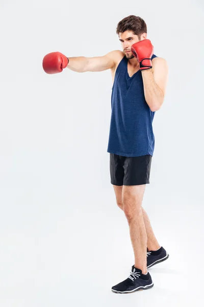 Full length portrait of a sportsman boxing in red gloves — Stock Photo, Image