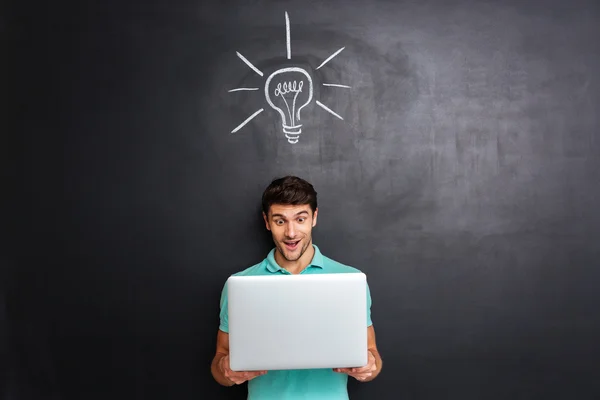 Man have an idea over background with drawn light bulb — Stock Photo, Image