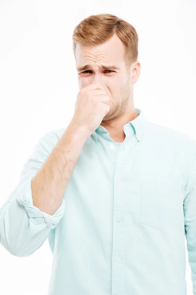 Hombre de negocios infeliz cerró la nariz a mano y sintiendo mal olor — Foto de Stock