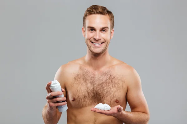 Sexy handsome young man with a shaving foam — Stock Photo, Image