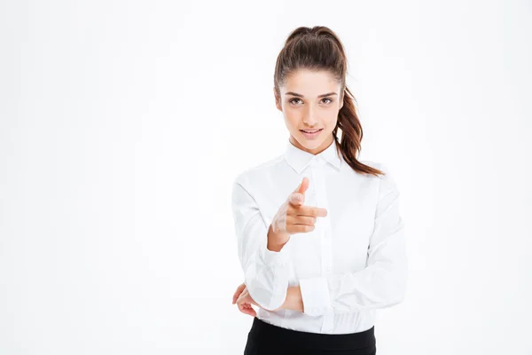Young happy businesswoman pointing at camera — Stock Photo, Image