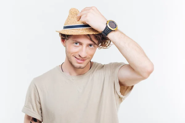 Veselá atraktivní mladý muž v klobouku, bílé pozadí — Stock fotografie