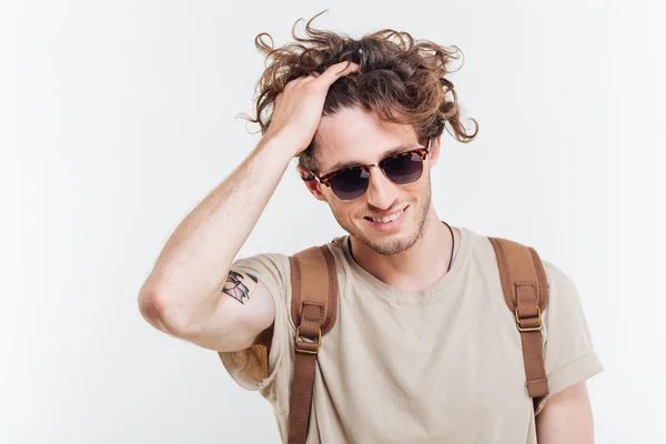 Portrait of a smiling handsome young man looking at camera — Stock Photo, Image