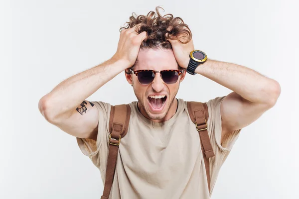 Portrait of a man shouting with hands over his head — Stock Photo, Image