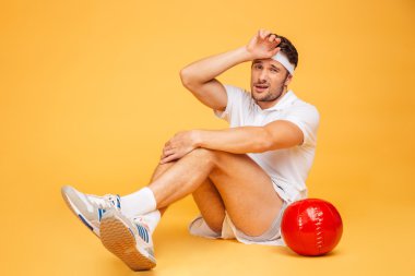 Funny sports man working out with fitness ball isolated clipart
