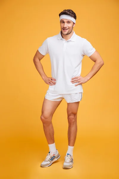 Full length of smiling athletic young sportsman — Stock Photo, Image