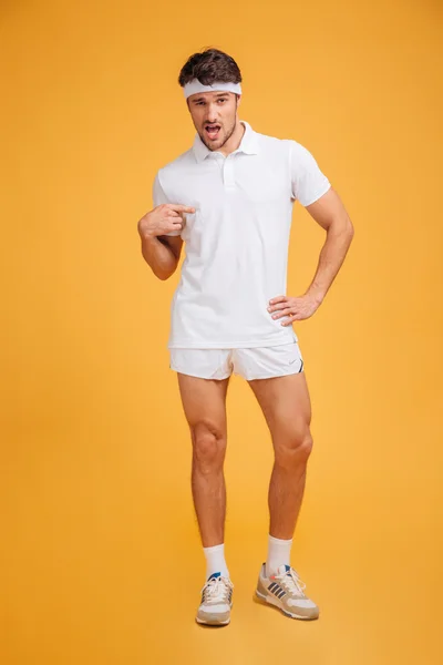 Funny confident young sportsman standing and pointing on himself — Stock Photo, Image