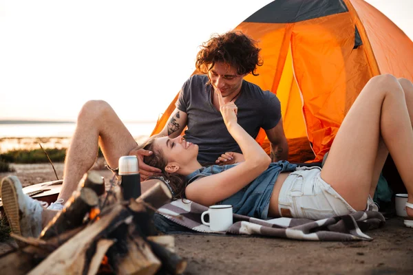 Portrait of couple in love relaxing at the camp tent — Stock Photo, Image