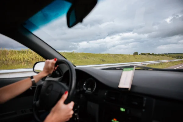 Woman driver driving car on the road — Stock Photo, Image