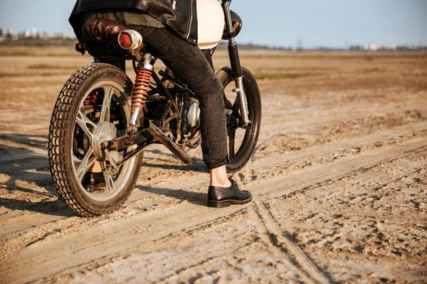 Cropped image of young brutal man driving retro motorcycle — Stock Photo, Image