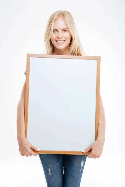 Full length portrait of a smiling woman holding blank board — Stock Photo, Image