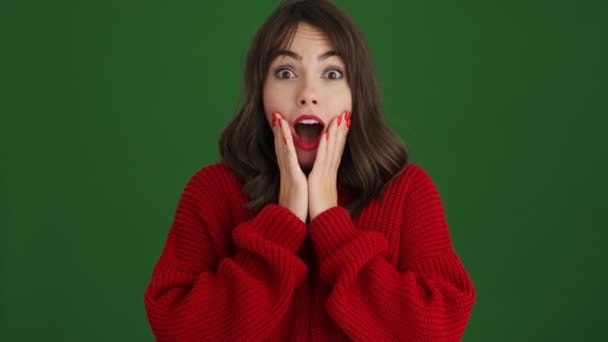 Surprised Woman Red Sweater Gesturing Camera Standing Isolated Green Background — Stock Video